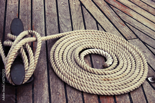 the rope is neatly folded on the ship's deck