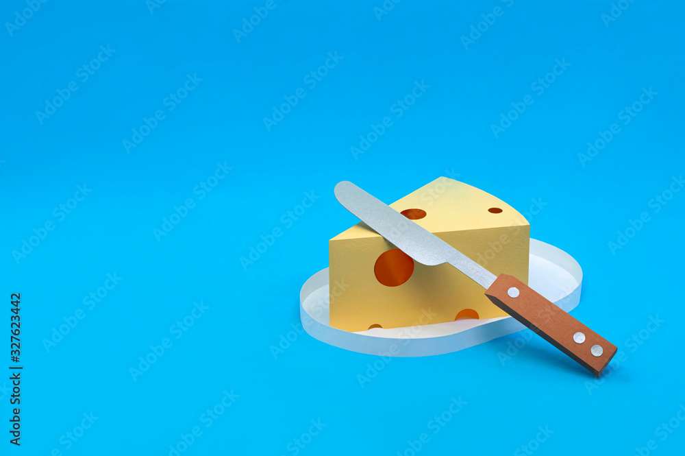 Paper triangular piece of Maasdam cheese Paper triangular piece of Maasdam cheese