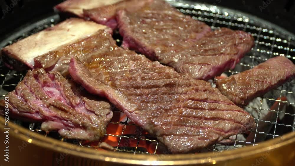 Korean BBQ Raw Beef on the Grill close-up p1 Korean BBQ Raw Beef on the Grill close-up p1