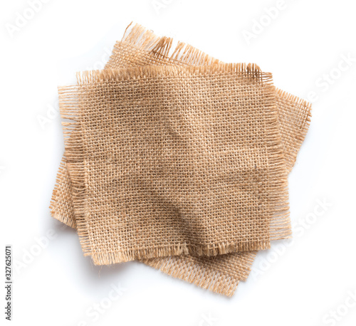 Canvas Print Old burlap fabric napkin, sackcloth piece isolated on white background
