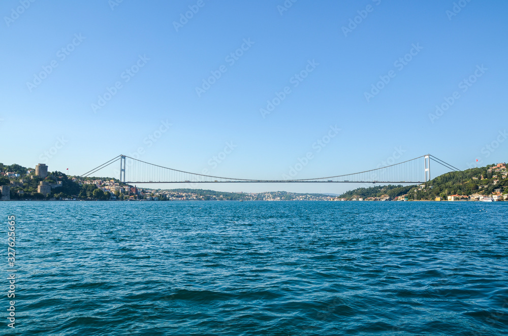 Fototapeta premium The Fatih Sultan Mehmet Bridge spans the Bosphorous strait between the European and Asian sides of Istanbul, Turkey. It is also known as the Second Bosphorous Bridge and is suspension bridge.