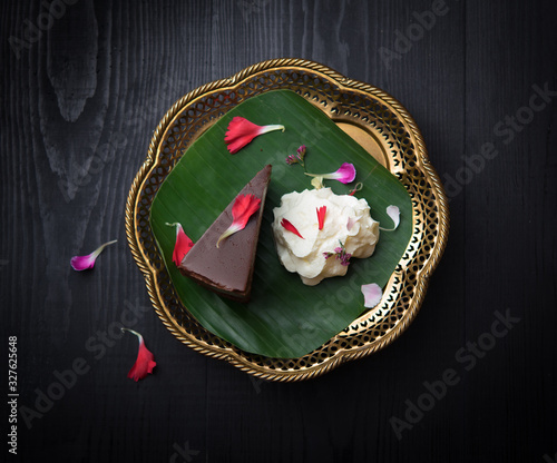 Piece of chocolate cake on wooden table