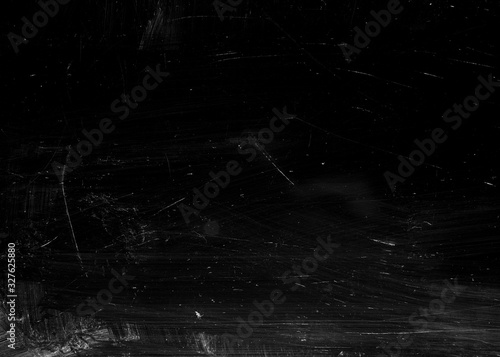 Texture of chips, scuffs, dirt on black glass