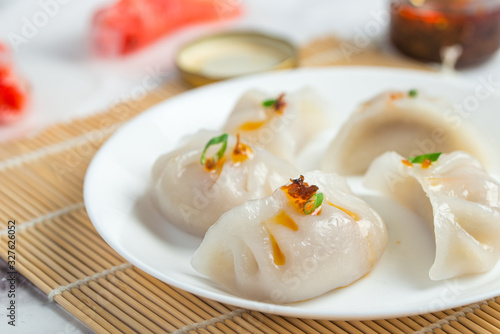Crystal dumplings with minced pork filing, served with XO sauce