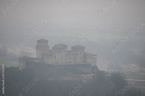 Torrechiara castle near Parma, Italy on a foggy and rainy day