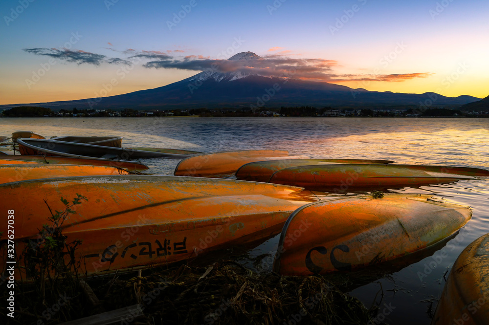 Fototapeta premium Landscape of Fuji Mountain with Beautiful Autumn Leaves. Iconic and Symbolic Mountain of Japan. Scenic Sunset Landscape of Fujisan at Evening Time, Kawaguchiko, Yamanashi, Japan.