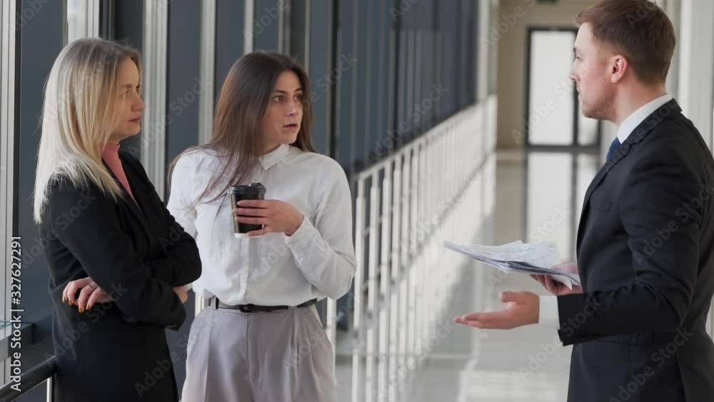 The disgruntled boss dismisses both employees for their work The disgruntled boss dismisses both employees for their work