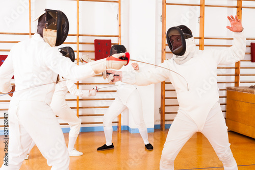 Fencers exercising techniques in battle