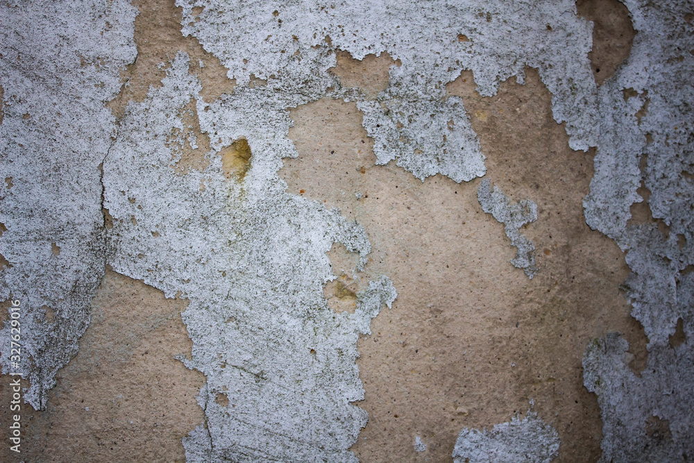 Obraz premium A old wall with cracks for background.Composition with concrete cement wall with crack in industrial building, Will be good for your design and texture background