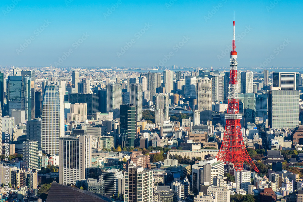 Japan. Tokyo. Tokyo Television Tower rises above the city. Panorama of Tokyo with a television tower. Japanese city top view. Red television tower. Sights of Japan. Japanese city landscape. Japan. Tokyo. Tokyo Television Tower rises above the city. Panorama of Tokyo with a television tower. Japanese city top view. Red television tower. Sights of Japan. Japanese city landscape.
