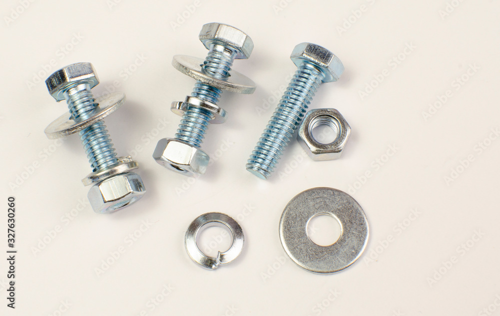 bolts and nuts, car washers on a white background bolts and nuts, car washers on a white background
