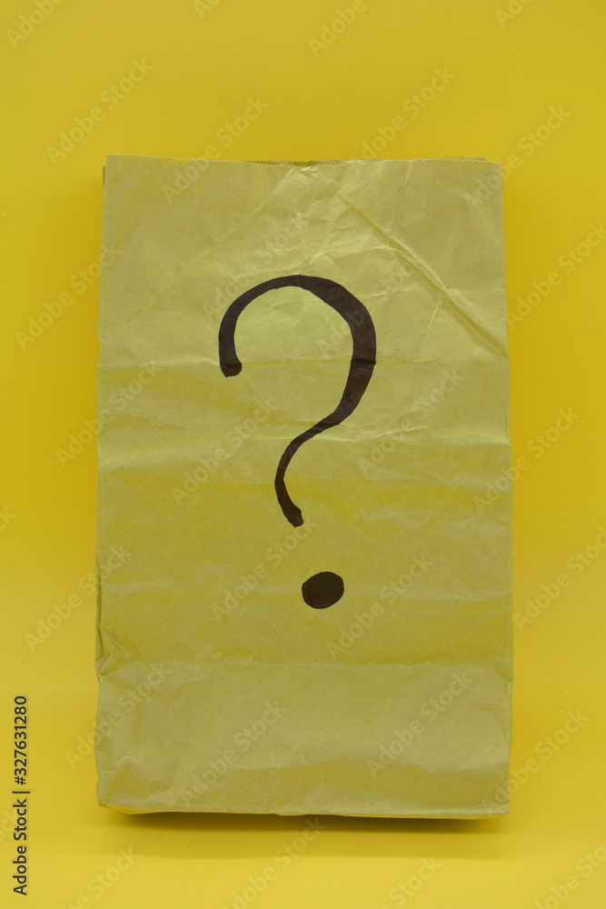 what's inside, a crumpled paper bag. Question concept what's inside, a crumpled paper bag. Question concept