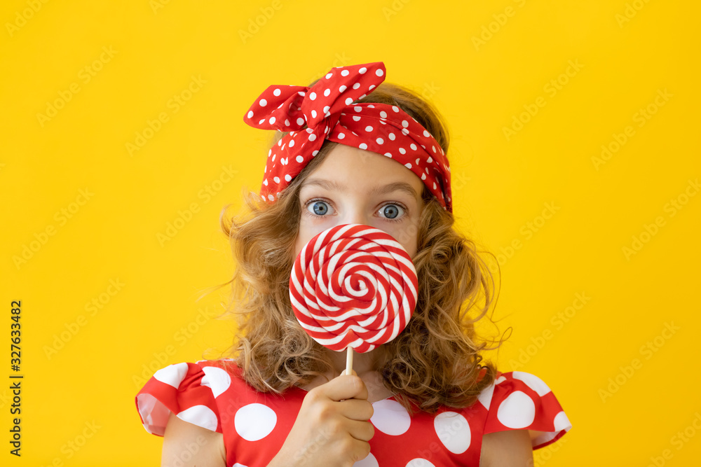 Teenager girl holding red lollipop