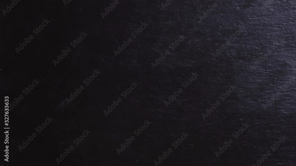 Stop motion animation of red hot peppers writing hot on slate background Stop motion animation of red hot peppers writing hot on slate background