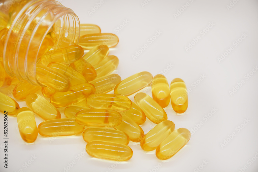 Fototapeta premium Fish oil capsules with omega 3 and vitamin D, healthy eating concept