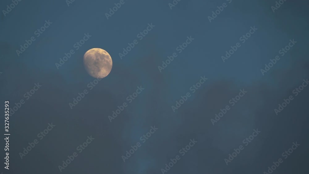 Big Yellow Moon in Cloudy Blue Evening Sky Big Yellow Moon in Cloudy Blue Evening Sky
