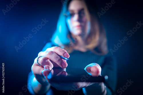 Girl holds out the phone to...