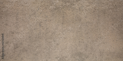 gray beige porous granular wall background texture with paint color rough surface plaster