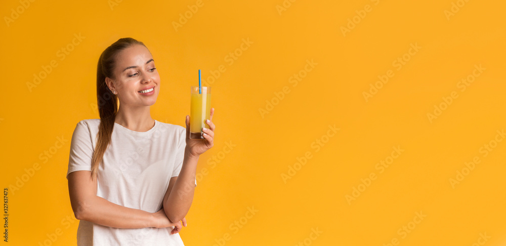 Portrait Of Happy Young Girl Holding Glass Of Orange Juice Portrait Of Happy Young Girl Holding Glass Of Orange Juice