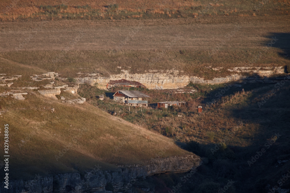 Obraz premium Mountain hut at sunset