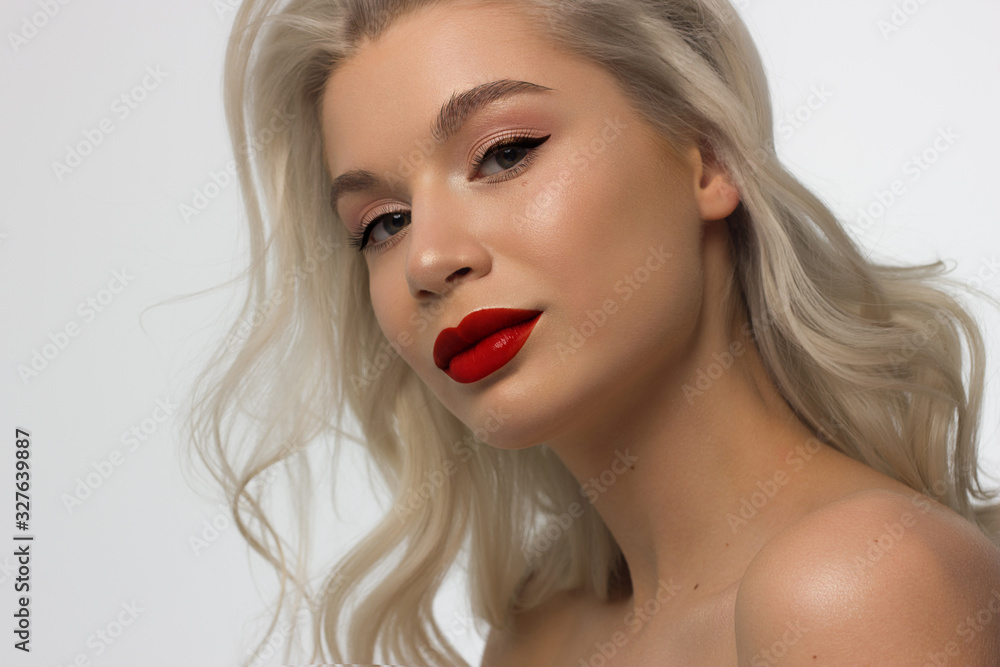 Closeup portrait of a woman with developing straight hair. Sweet tender young girl blonde. Natural lipstick, transparent clean skin. Skin care natural cosmetics in the spa salon or cosmetology. Closeup portrait of a woman with developing straight hair. Sweet tender young girl blonde. Natural lipstick, transparent clean skin. Skin care natural cosmetics in the spa salon or cosmetology.