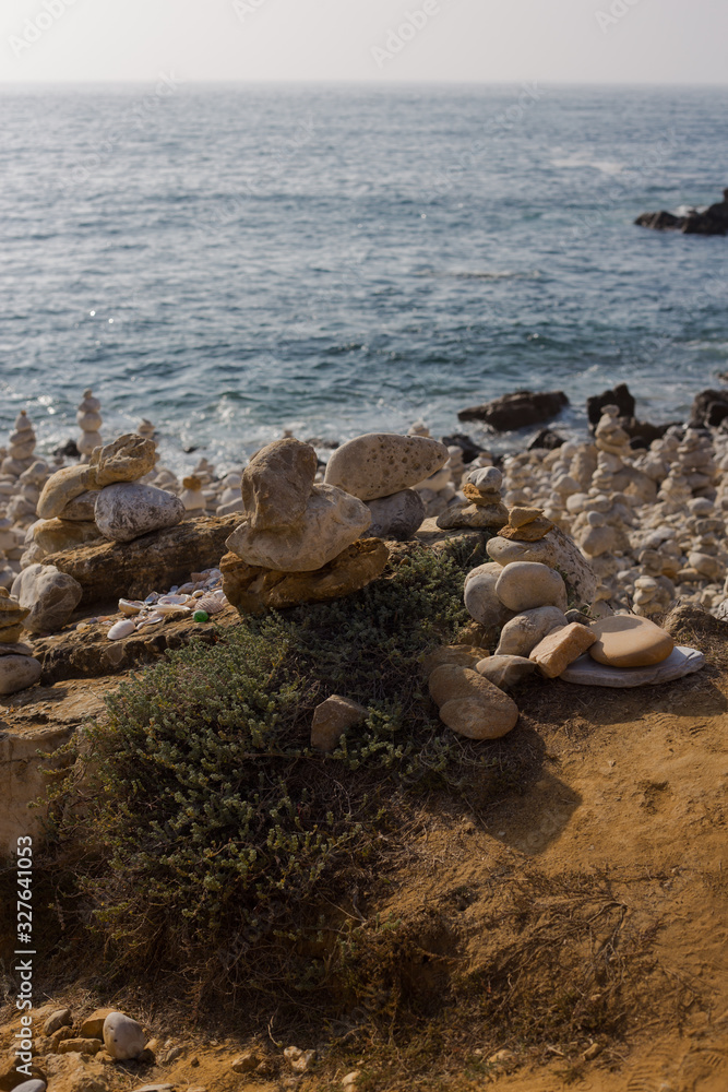 Beach with stacks of rocks called a cairns. Peniche Portugal Stock Photo Adobe Stock