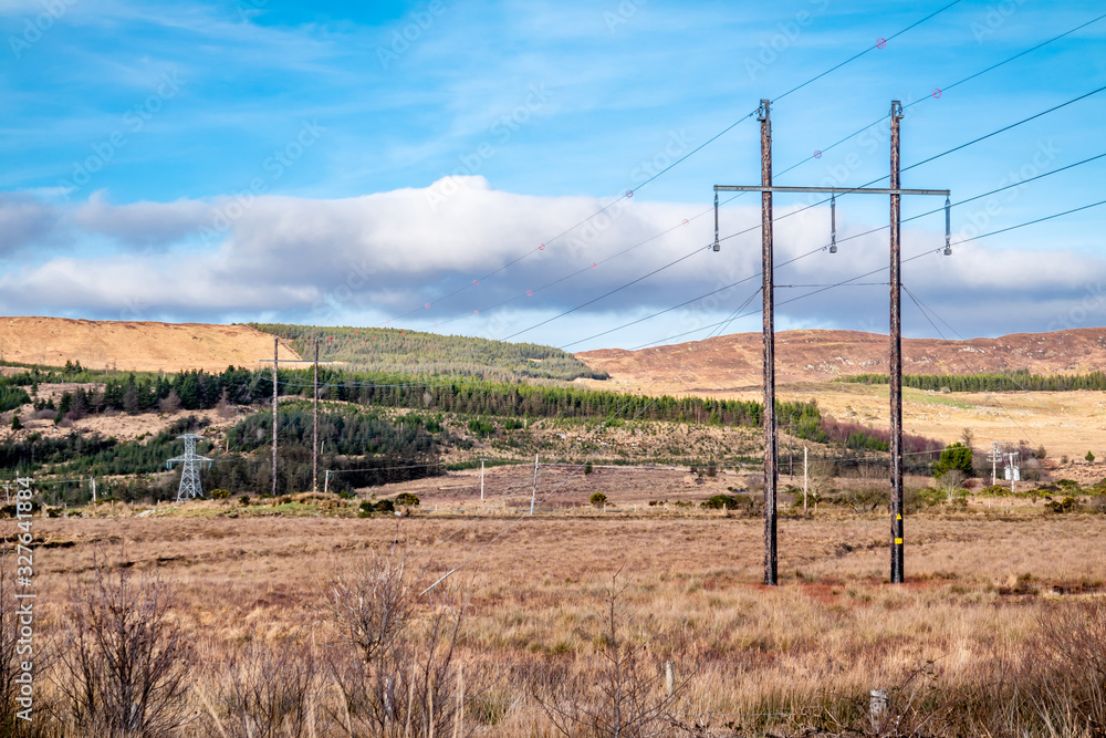 Typical power lines in rural landscape of Ireland