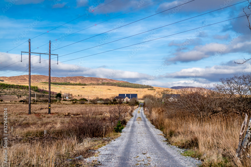 Typical power lines in rural landscape of Ireland