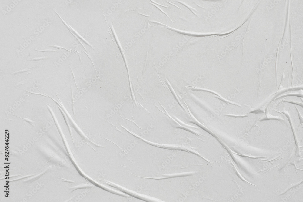Fototapeta premium Crumpled white paper. Abstract background for the designer.