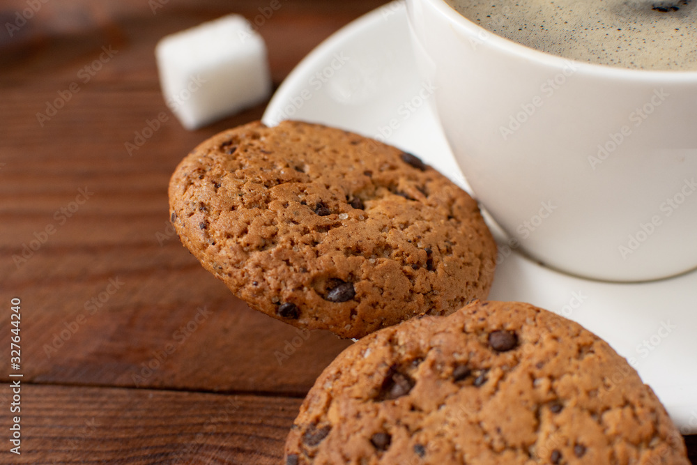Espresso coffee on a wooden background with cookies. Still-life. Selective focus. Espresso coffee on a wooden background with cookies. Still-life. Selective focus.