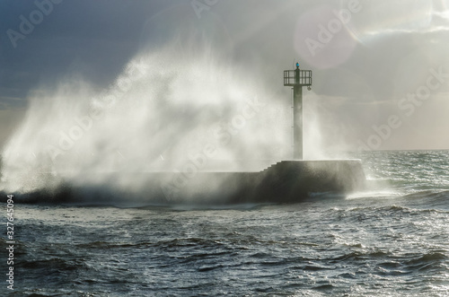 HURRICANE BY THE SEA - Storm waves crashing on the breakwater in the port