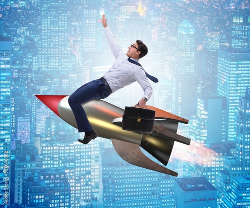 Businessman flying on rocket in business concept © Elnur