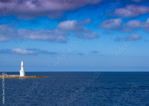 White lighthouse in La Savina, Formentera island, Balearic, Spain