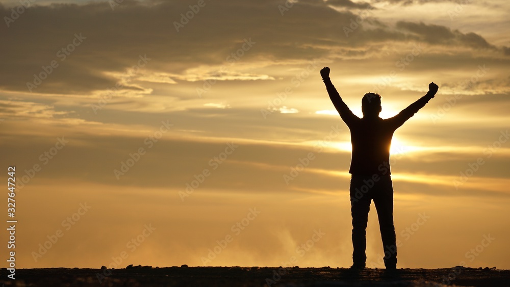 Silhouette of Man With Arms Aaised at Sunset Silhouette of Man With Arms Aaised at Sunset