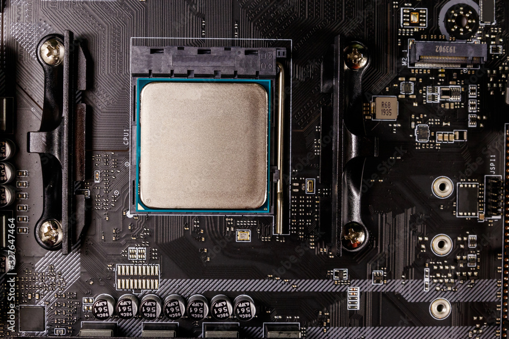 Fototapeta premium Close-up of a modern computer motherboard with installed cpu. Electronic computer hardware technology