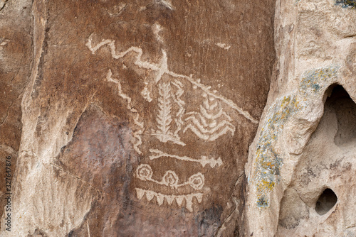 USA, Nevada, Lincoln County, Basin and Range National Monument. Complex Native American petroglyph panel in White River Narrows with corn, crops, plants, rivers, arrow, concentric circles, triangles.