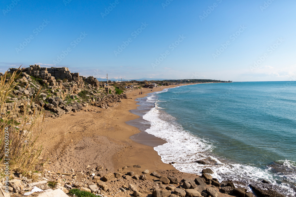 Blue sea at a beautiful beach with blue sky Blue sea at a beautiful beach with blue sky
