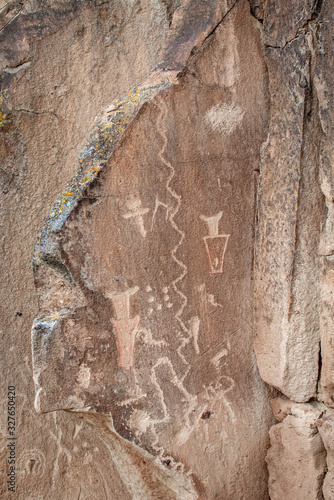 USA, Nevada, Lincoln County, Basin and Range National Monument. A combination of pecking and red paint was used by Native Americans to create this rock art panel with painted petroglyphs. photo