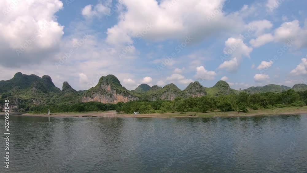 Impressive karst landscape on the riverbanks of the magnificent Li River between Guilin and Yangshuo in China Impressive karst landscape on the riverbanks of the magnificent Li River between Guilin and Yangshuo in China