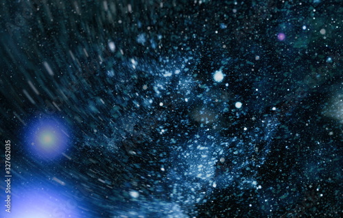 Cosmic pattern with soft blur on dark background, suitable for desktop wallpaper or for creative graphic design. photo