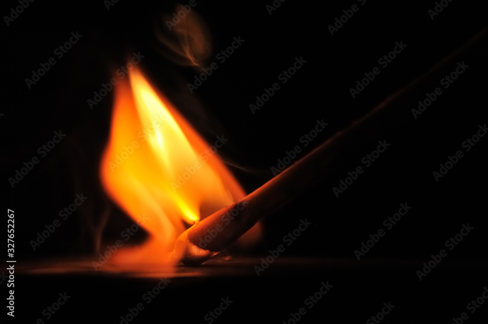Matchstick ignites with the help of the matchbox with beautiful flames and smoke. Matchstick ignites with the help of the matchbox with beautiful flames and smoke.
