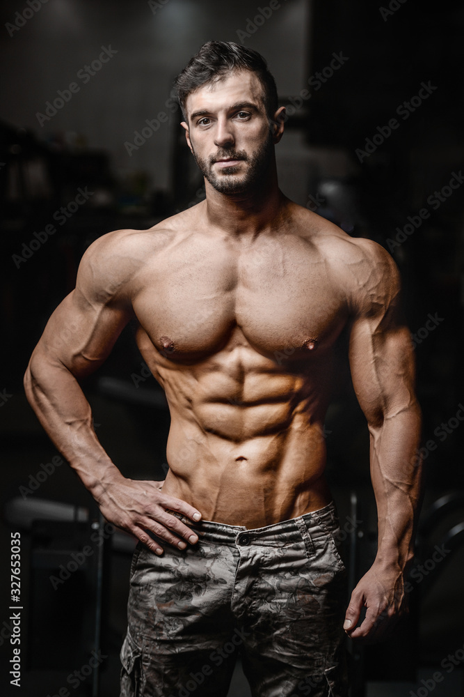 Fototapeta premium Bodybuilder athletic man workout muscles exercise.