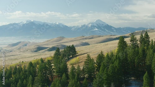 The Absaroka mountains tower above the Paradise Valley and Yellowstone river in a color filled Montana autumn photo