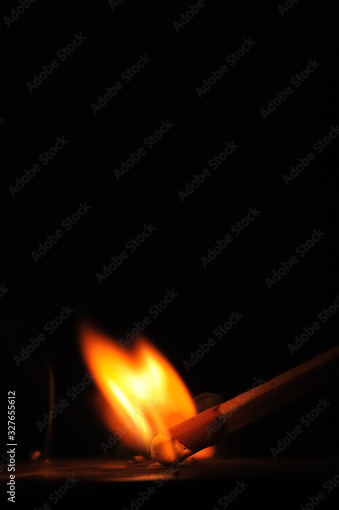 Matchstick ignites with the help of the matchbox with beautiful flames and smoke. Matchstick ignites with the help of the matchbox with beautiful flames and smoke.