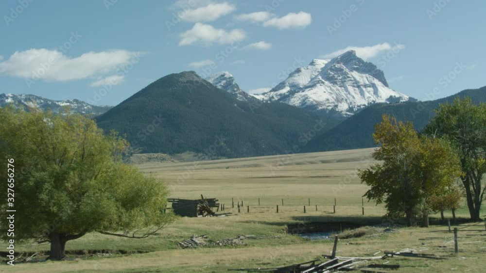 The snow covered peaks, steep cliffs and glacial valleys of the Madison mountain range in southwestern Montana The snow covered peaks, steep cliffs and glacial valleys of the Madison mountain range in southwestern Montana