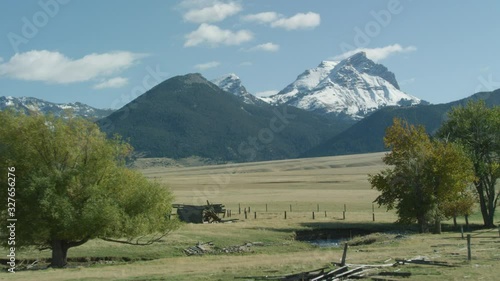 The snow covered peaks, steep cliffs and glacial valleys of the Madison mountain range in southwestern Montana photo