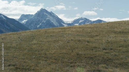 Reveal snow covered peaks of the Madison mountain range in southwestern Montana photo