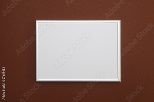 Photo frame on a brown background. Copy space