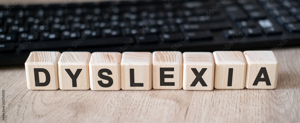 Dislexia text concept written in Wooden Cube Dislexia text concept written in Wooden Cube