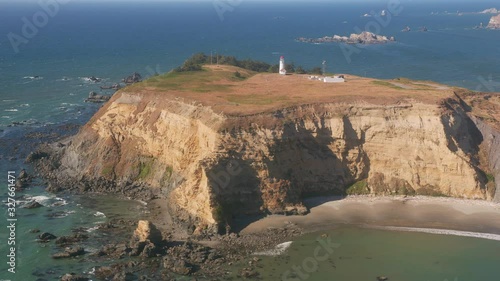 Oregon Coast circa-2019.  Aerial view of Cape Blanco Lighthouse.  Shot from helicopter with cineflex gimal and RED 8K camera. photo